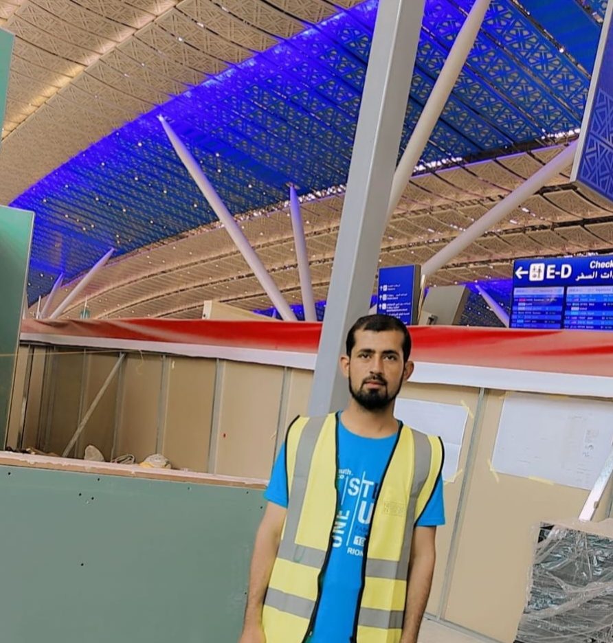 Al Khidmat Fixers technician in a high-visibility vest during a commercial fit-out